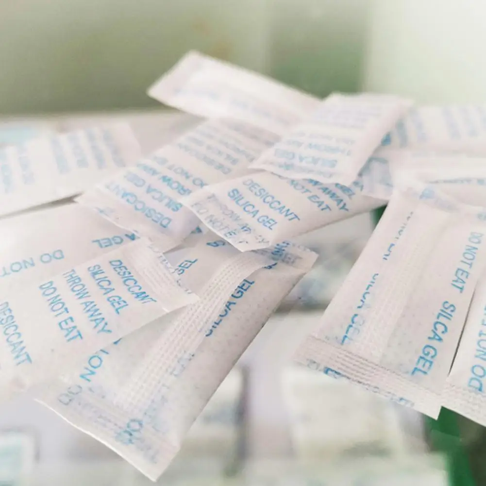 20/50/100 แพ็ค 0.5g ปลอดสารพิษซิลิกาเจลซองสารดูดความชื้นชื้นห้องครัว Living Moisture เครื่องลดความชื้น Accessorie หน้ากระเป๋า